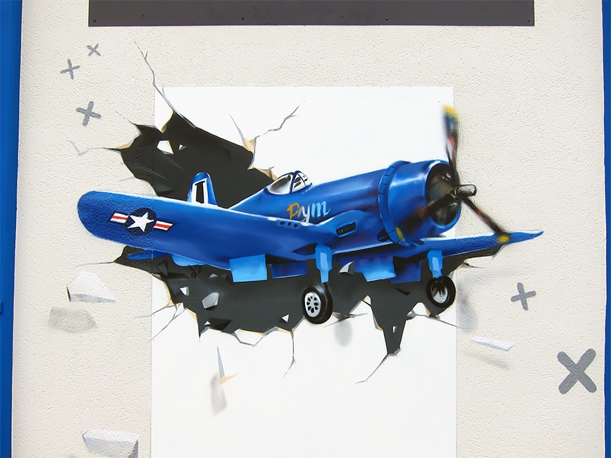 fresque graffiti enfant avion